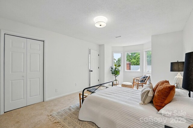 1035 Wexford Pl NW, Concord, NC 28027 - carpeted bedroom with baseboards and a textured ceiling