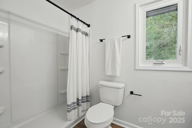1035 Wexford Pl NW, Concord, NC 28027 - bathroom featuring toilet, a shower with curtain, and baseboards