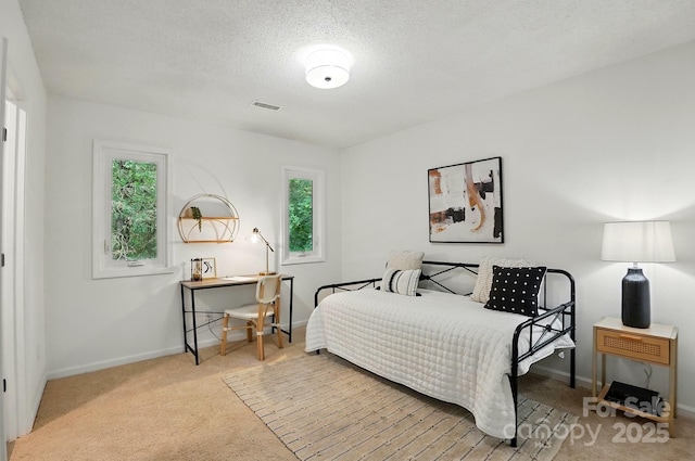 1035 Wexford Pl NW, Concord, NC 28027 - carpeted bedroom with multiple windows, baseboards, and a textured ceiling
