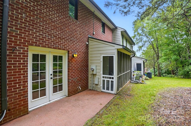 1035 Wexford Pl NW, Concord, NC 28027 - rear view of house featuring brick siding, central air condition unit, a yard, french doors, and a patio area