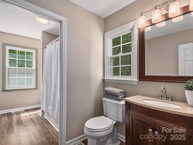 181 Junaluska Oaks Dr, Waynesville, NC 28786 - full bathroom with wood finished floors, vanity, a textured wall, and a shower with curtain