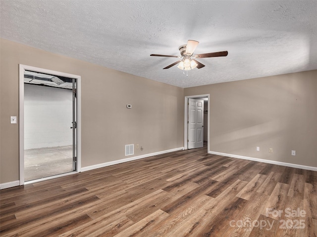 181 Junaluska Oaks Dr, Waynesville, NC 28786 - empty room with a ceiling fan, a textured ceiling, and wood finished floors
