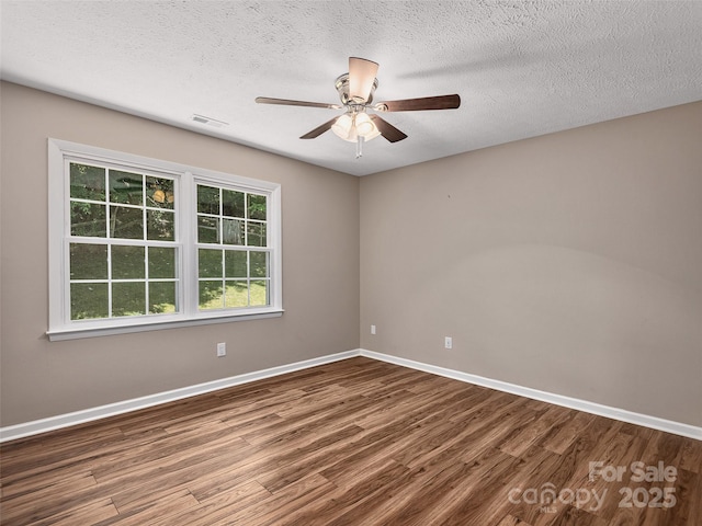 181 Junaluska Oaks Dr, Waynesville, NC 28786 - spare room featuring wood finished floors, a ceiling fan, and a textured ceiling