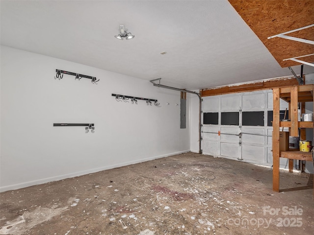 181 Junaluska Oaks Dr, Waynesville, NC 28786 - garage featuring electric panel and baseboards