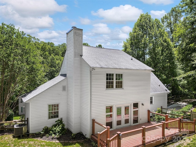 181 Junaluska Oaks Dr, Waynesville, NC 28786 - back of property with a wooden deck, a shingled roof, a chimney, and french doors