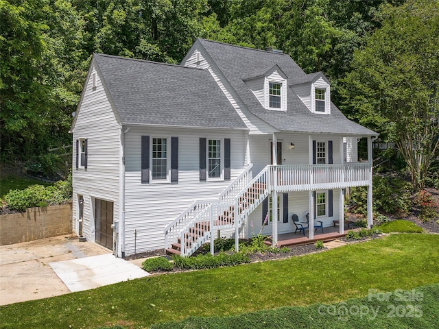 181 Junaluska Oaks Dr, Waynesville, NC 28786 - view of front of home featuring a porch, a front lawn, concrete driveway, a shingled roof, and stairs