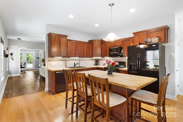 28 Richie St, Asheville, NC 28801 - kitchen featuring black appliances, a sink, wood counters, backsplash, and recessed lighting