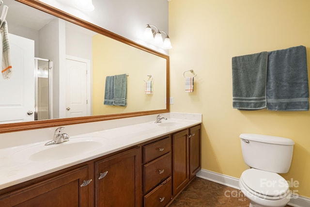 28 Richie St, Asheville, NC 28801 - full bath with double vanity, baseboards, an enclosed shower, toilet, and tile patterned flooring