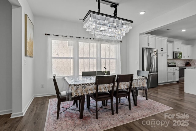 3127 Pinehills Way, Mount Holly, NC 28120 - dining space featuring a chandelier, dark wood-style flooring, baseboards, and recessed lighting