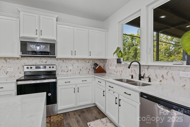 3127 Pinehills Way, Mount Holly, NC 28120 - kitchen with appliances with stainless steel finishes, a sink, white cabinetry, and dark wood finished floors