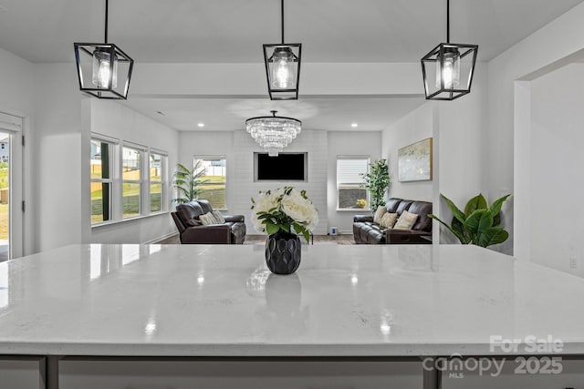 3127 Pinehills Way, Mount Holly, NC 28120 - kitchen with light stone counters, open floor plan, and a kitchen island