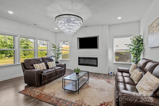 3127 Pinehills Way, Mount Holly, NC 28120 - living area featuring a chandelier, wood finished floors, a large fireplace, recessed lighting, and baseboards
