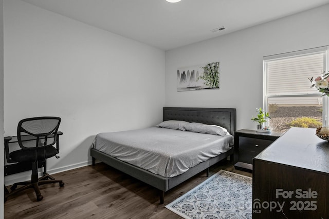 3127 Pinehills Way, Mount Holly, NC 28120 - bedroom featuring dark wood-type flooring and baseboards