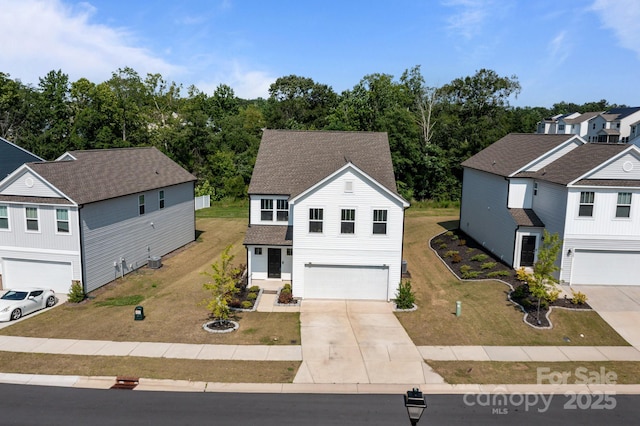 3127 Pinehills Way, Mount Holly, NC 28120 - traditional-style house featuring driveway, an attached garage, a front lawn, and a shingled roof