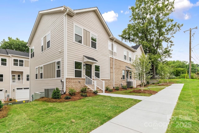 3924 Hager Dr, Charlotte, NC 28208 - view of front facade featuring a front lawn, central air condition unit, and brick siding