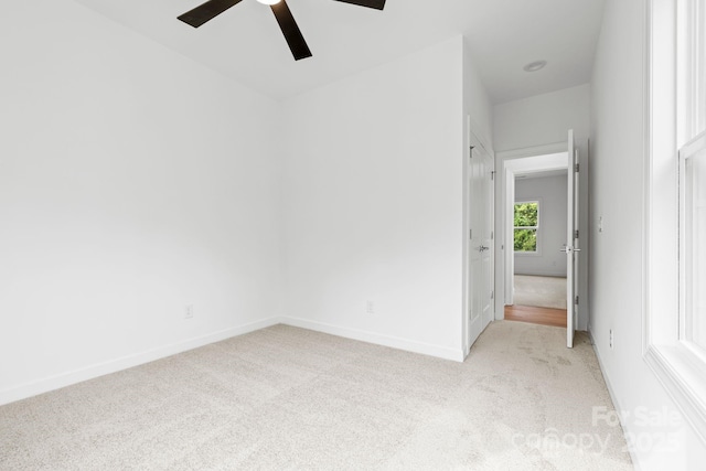 3924 Hager Dr, Charlotte, NC 28208 - spare room featuring light carpet, a ceiling fan, and baseboards