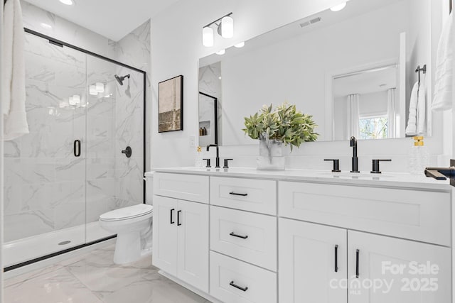 3924 Hager Dr, Charlotte, NC 28208 - bathroom with double vanity, marble finish flooring, a marble finish shower, toilet, and recessed lighting