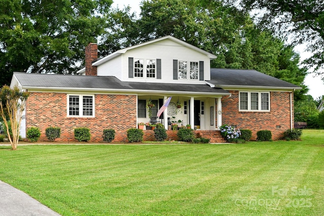 7448 Forney Hill Rd, Denver, NC 28037 - view of front of property featuring brick siding, covered porch, a front lawn, and a chimney