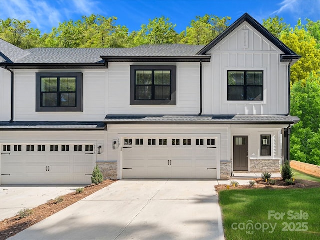 8315 Adrian Ct, Charlotte, NC 28270 - view of front of property with an attached garage, concrete driveway, board and batten siding, and stone siding