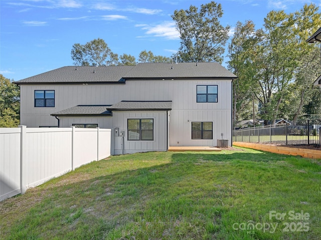 8315 Adrian Ct, Charlotte, NC 28270 - back of property featuring a fenced backyard and a shingled roof