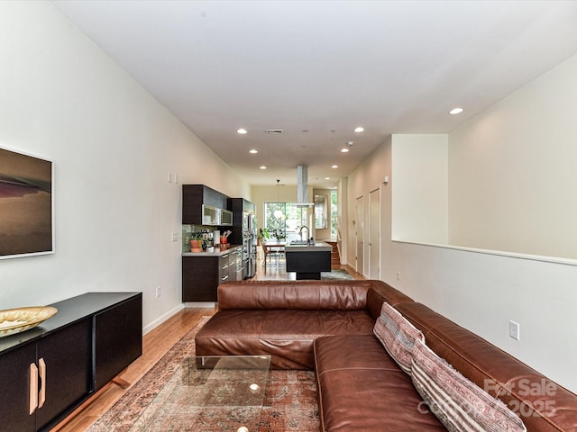 314 Viburnum Way Ct, Charlotte, NC 28208 - living area featuring recessed lighting, light wood finished floors, and baseboards