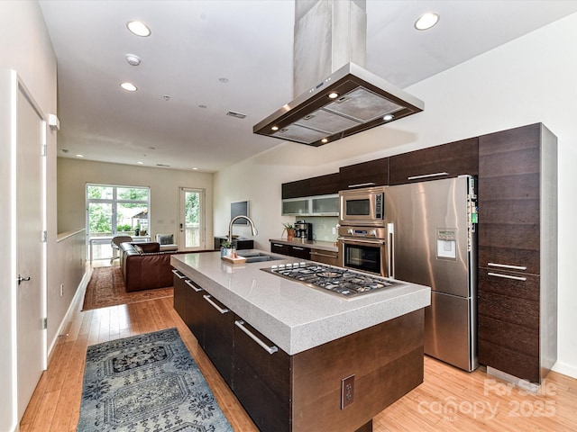 314 Viburnum Way Ct, Charlotte, NC 28208 - kitchen with a sink, stainless steel appliances, island exhaust hood, modern cabinets, and light wood-style flooring