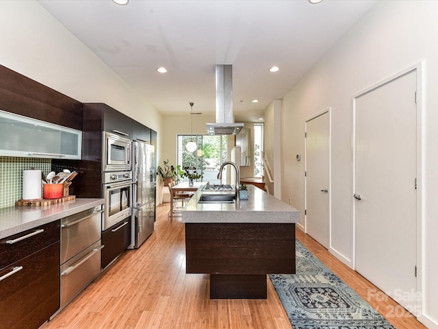 314 Viburnum Way Ct, Charlotte, NC 28208 - kitchen featuring stainless steel appliances, island range hood, modern cabinets, light countertops, and recessed lighting