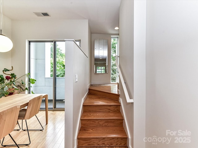 314 Viburnum Way Ct, Charlotte, NC 28208 - stairs with wood finished floors and baseboards