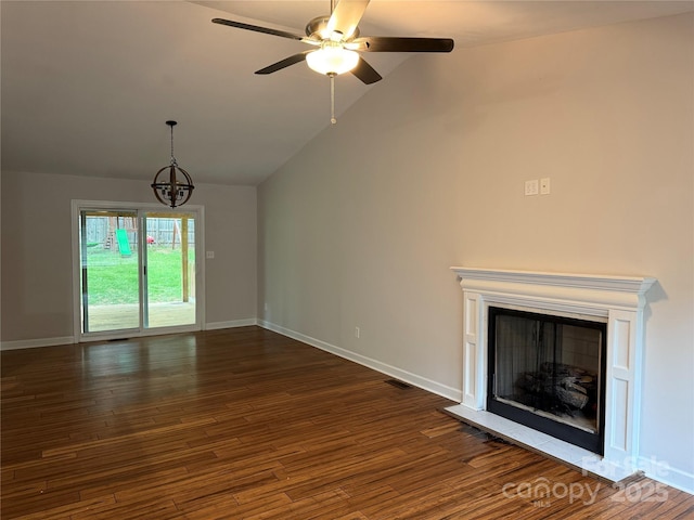 2015 Downey St, Rock Hill, SC 29732 - unfurnished living room featuring dark wood finished floors, a chandelier, ceiling fan, baseboards, and high vaulted ceiling