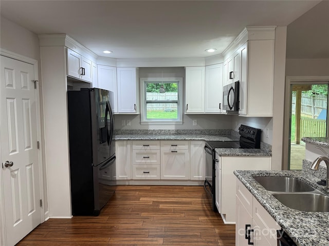 2015 Downey St, Rock Hill, SC 29732 - kitchen with black appliances, a sink, white cabinets, dark wood-style floors, and recessed lighting