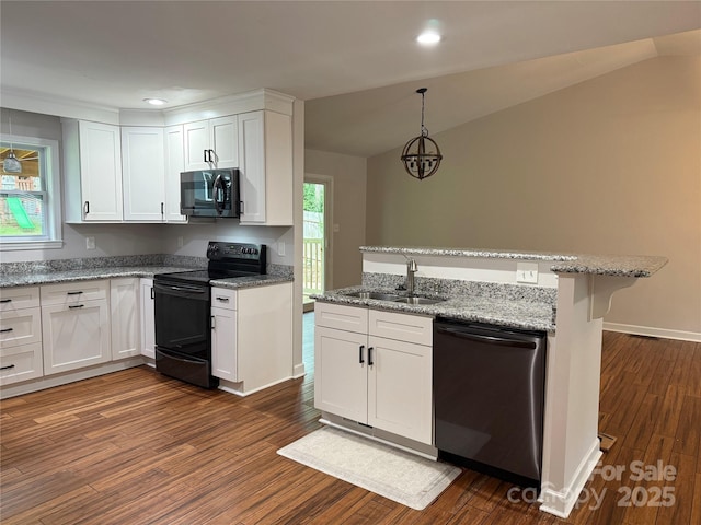 2015 Downey St, Rock Hill, SC 29732 - kitchen featuring stainless steel appliances, a sink, dark wood-style flooring, white cabinets, and light stone countertops