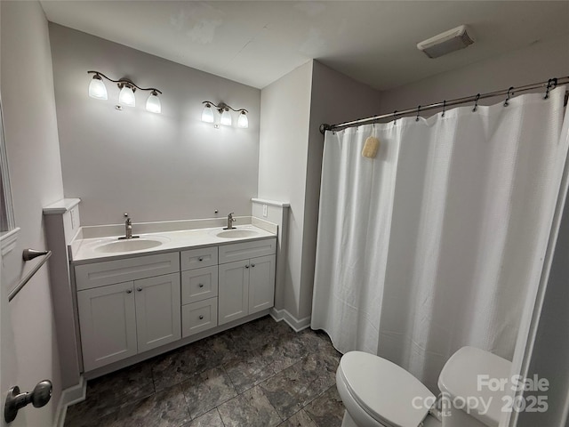 2015 Downey St, Rock Hill, SC 29732 - bathroom featuring toilet, double vanity, a shower with shower curtain, and stone finish flooring