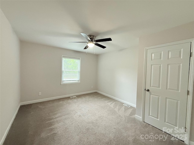 2015 Downey St, Rock Hill, SC 29732 - spare room with a ceiling fan, baseboards, and carpet floors