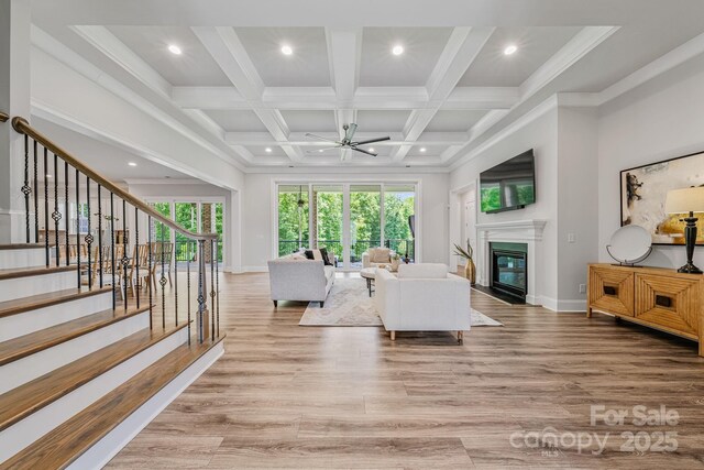 1702 Batson Creek Ln, Weddington, NC 28104 - living area with ceiling fan, a premium fireplace, recessed lighting, beam ceiling, and light wood finished floors