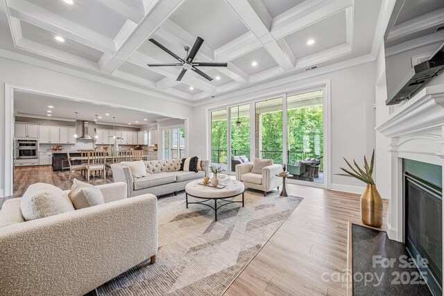 1702 Batson Creek Ln, Weddington, NC 28104 - living area featuring healthy amount of natural light, ceiling fan, a fireplace, recessed lighting, and beamed ceiling