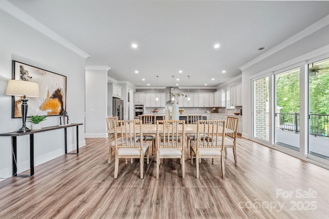 1702 Batson Creek Ln, Weddington, NC 28104 - dining area with ornamental molding, light wood-style flooring, and recessed lighting