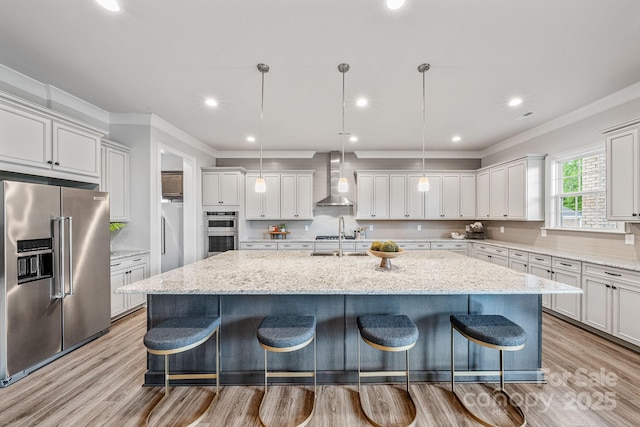 1702 Batson Creek Ln, Weddington, NC 28104 - kitchen featuring stainless steel appliances, wall chimney exhaust hood, a large island with sink, a kitchen bar, and tasteful backsplash