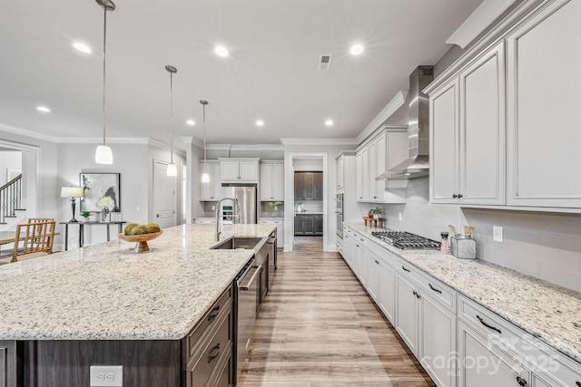 1702 Batson Creek Ln, Weddington, NC 28104 - kitchen featuring wall chimney range hood, stainless steel appliances, crown molding, recessed lighting, and a spacious island
