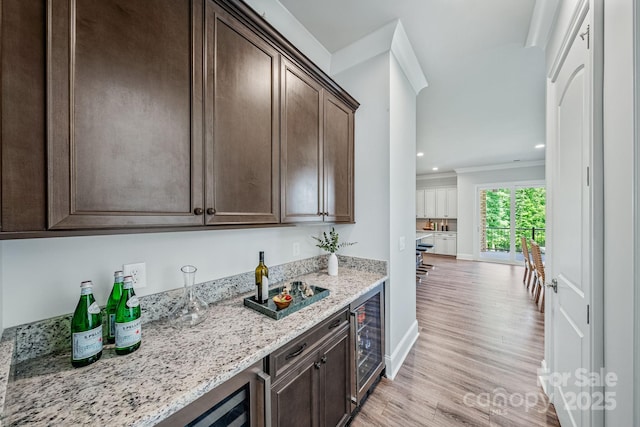 1702 Batson Creek Ln, Weddington, NC 28104 - indoor dry bar featuring beverage cooler, light wood-style floors, crown molding, and recessed lighting