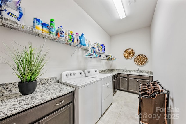 1702 Batson Creek Ln, Weddington, NC 28104 - laundry area featuring washer and dryer, cabinet space, and light tile patterned flooring