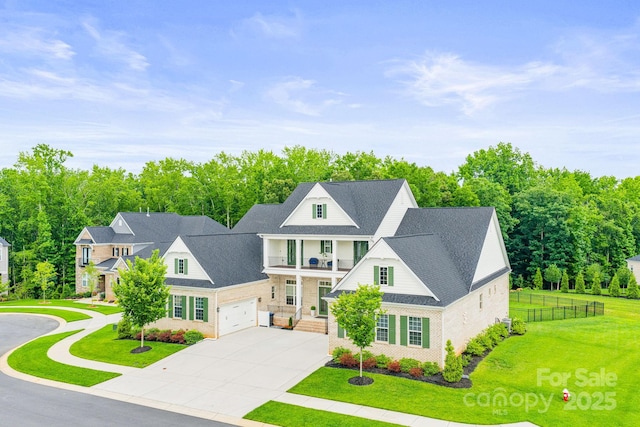 1702 Batson Creek Ln, Weddington, NC 28104 - view of front facade featuring a balcony, driveway, and roof with shingles