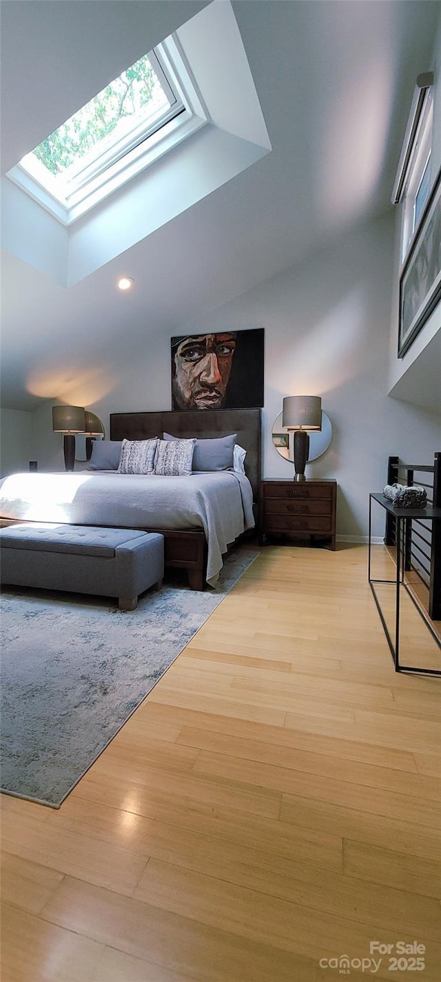 308 Woodfield Dr, Asheville, NC 28803 - bedroom with a skylight, light wood finished floors, and recessed lighting