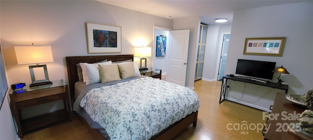 308 Woodfield Dr, Asheville, NC 28803 - bedroom with wood finished floors