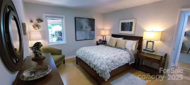 308 Woodfield Dr, Asheville, NC 28803 - bedroom with fridge, baseboards, and wood finished floors