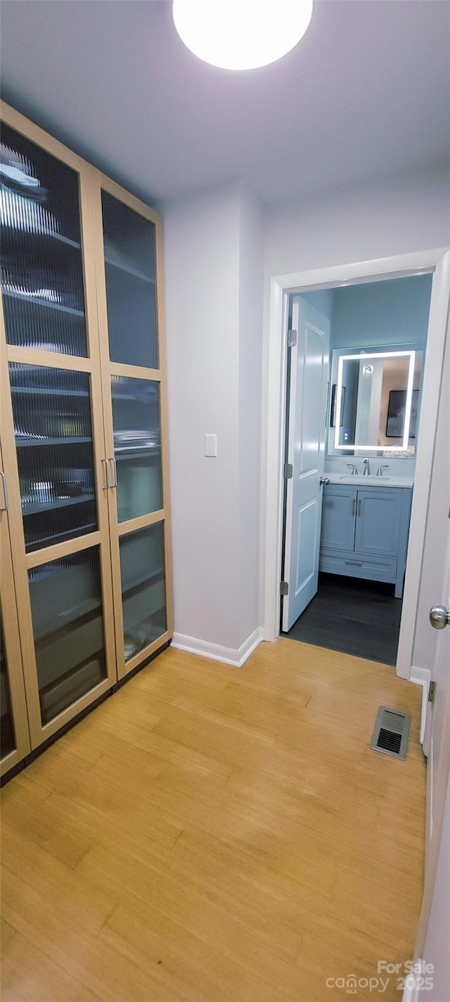 308 Woodfield Dr, Asheville, NC 28803 - corridor with wood finished floors and baseboards