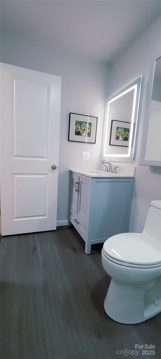 308 Woodfield Dr, Asheville, NC 28803 - half bath with toilet, wood finished floors, and vanity