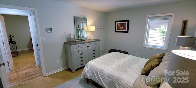 308 Woodfield Dr, Asheville, NC 28803 - bedroom with light wood-type flooring and baseboards