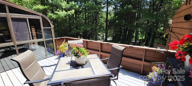 308 Woodfield Dr, Asheville, NC 28803 - deck featuring outdoor dining space and view of scattered trees