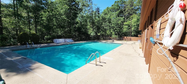 308 Woodfield Dr, Asheville, NC 28803 - community pool featuring a patio area and view of scattered trees