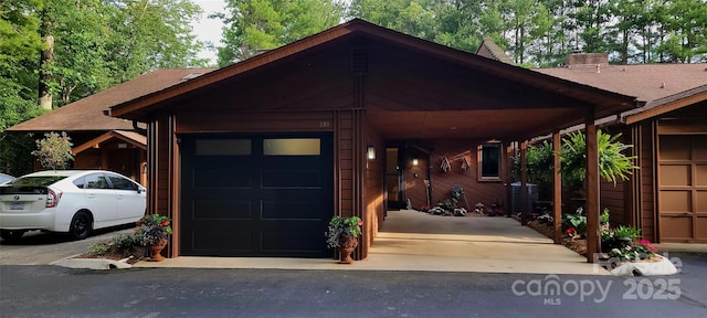 308 Woodfield Dr, Asheville, NC 28803 - view of front facade with a carport, an attached garage, and driveway